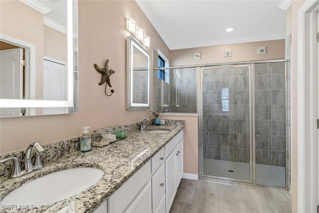 bathroom featuring hardwood / wood-style flooring, vanity, a shower with shower door, and ornamental molding