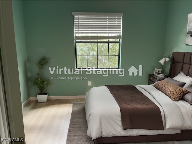 bedroom featuring light wood-type flooring