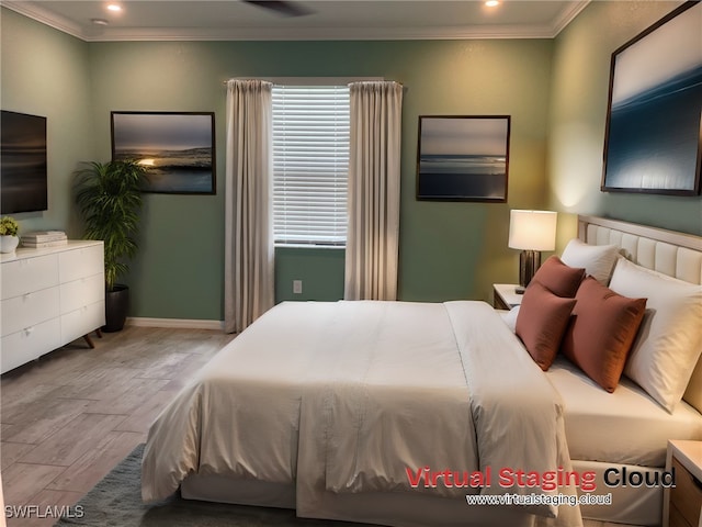 bedroom featuring light hardwood / wood-style floors and ornamental molding