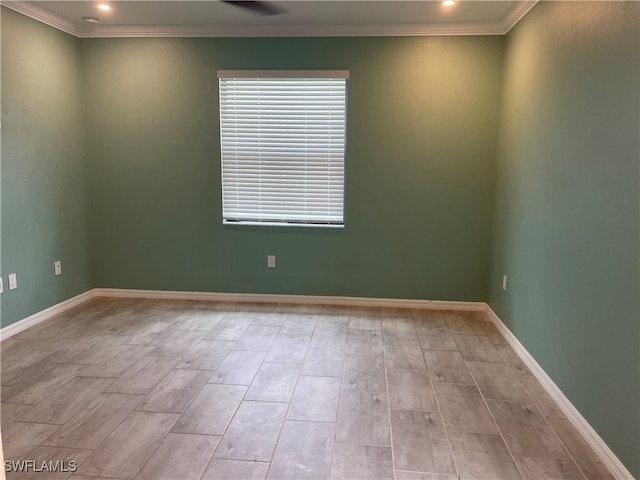 unfurnished room featuring light hardwood / wood-style floors and ornamental molding