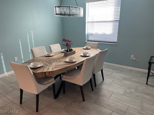 dining space featuring a chandelier