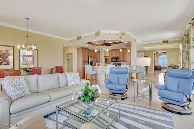 tiled living room featuring crown molding and an inviting chandelier