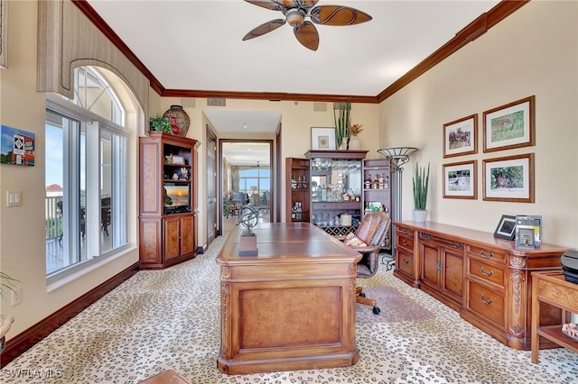 office featuring light carpet, crown molding, and plenty of natural light