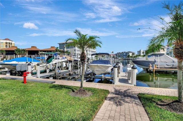 dock area featuring a yard and a water view