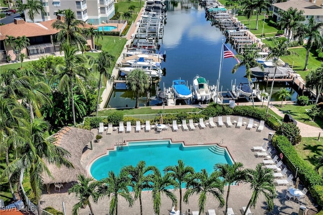 birds eye view of property with a water view