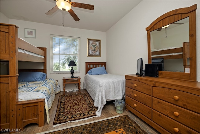 bedroom featuring lofted ceiling, ceiling fan, and hardwood / wood-style flooring