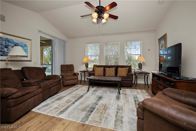 living room featuring lofted ceiling, ceiling fan, and hardwood / wood-style floors