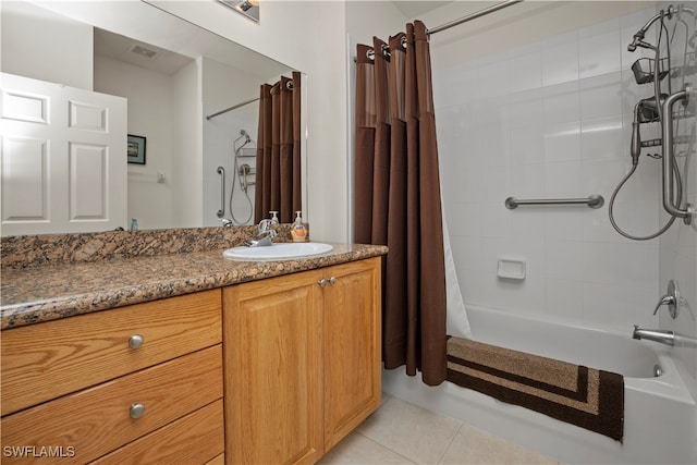 bathroom with vanity, shower / bath combo with shower curtain, and tile patterned floors