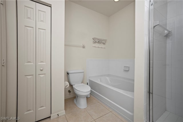 bathroom with tile patterned flooring, separate shower and tub, and toilet