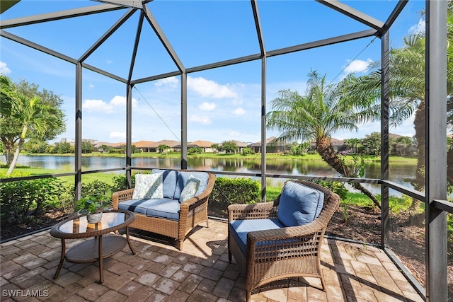 sunroom / solarium with a water view