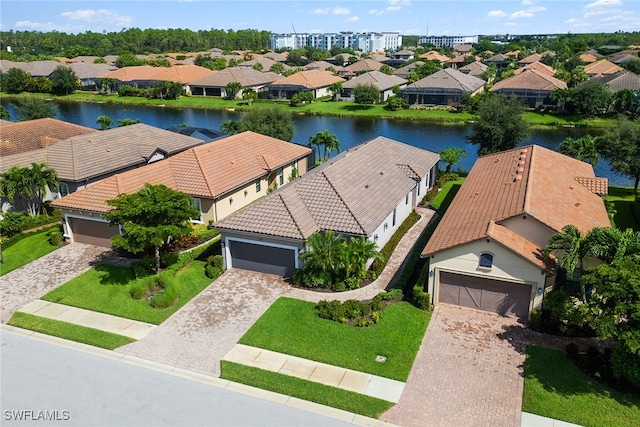 birds eye view of property featuring a water view