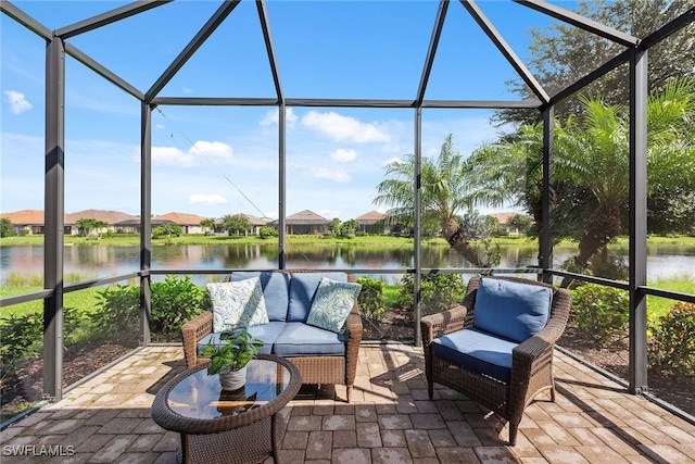 sunroom / solarium with a water view