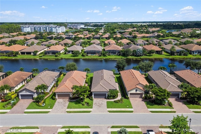 birds eye view of property featuring a water view