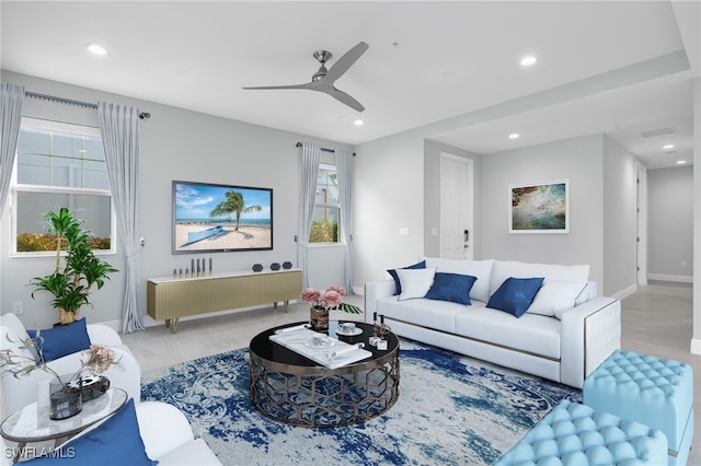 living room with ceiling fan and light hardwood / wood-style floors