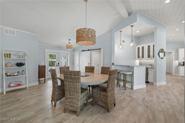 dining room with wooden ceiling, lofted ceiling, and light hardwood / wood-style flooring