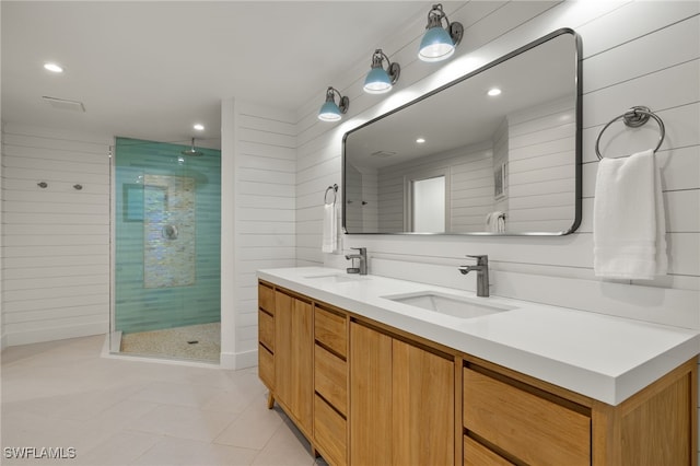 bathroom featuring vanity, tile patterned floors, and a shower with shower door