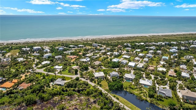 aerial view with a view of the beach and a water view