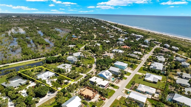 aerial view with a beach view and a water view