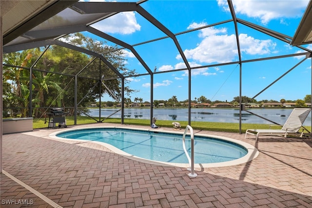 view of swimming pool featuring area for grilling, a lanai, a patio, and a water view