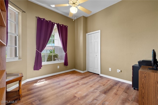 interior space featuring light wood-type flooring and ceiling fan