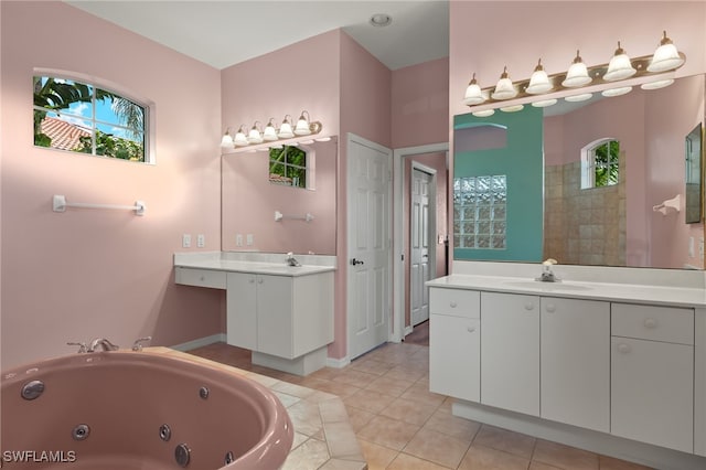 bathroom featuring shower with separate bathtub, vanity, and tile patterned floors