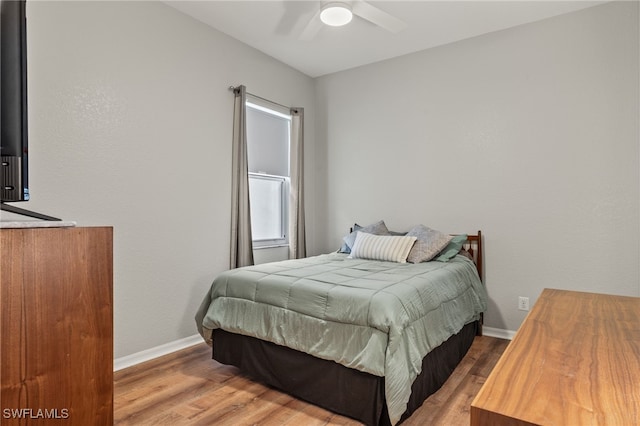 bedroom with light wood-type flooring and ceiling fan