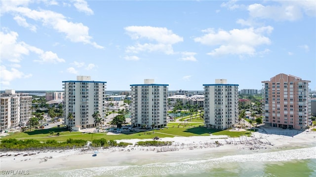 aerial view featuring a view of the beach and a water view