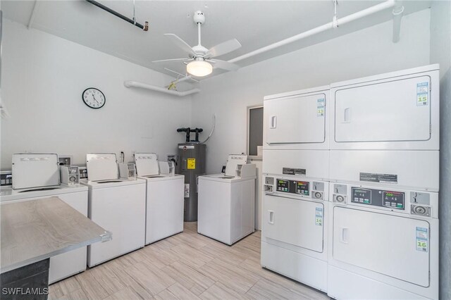 laundry area with water heater, ceiling fan, stacked washer / dryer, and washer and dryer