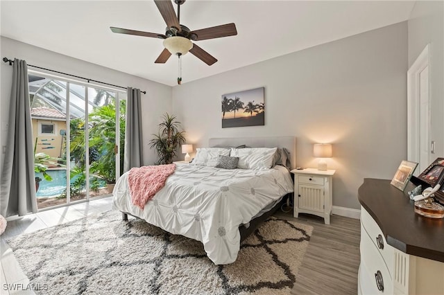 11490 Axis Deer Ln, Fort Myers, FL 33966 - bedroom with wood finished floors, a ceiling fan, and access to outside