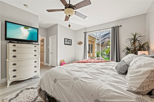 bedroom with ceiling fan and light hardwood / wood-style flooring