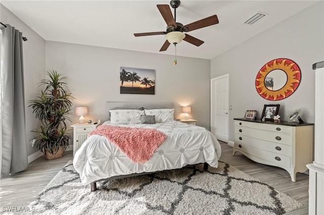 11490 Axis Deer Ln, Fort Myers, FL 33966 - bedroom with light wood-type flooring and ceiling fan