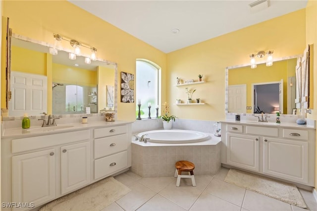 11490 Axis Deer Ln, Fort Myers, FL 33966 - bathroom with a shower stall, tile patterned flooring, a garden tub, and two vanities