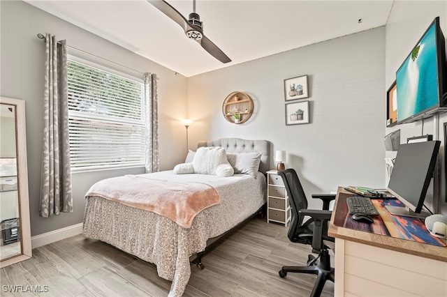 bedroom featuring ceiling fan and hardwood / wood-style flooring