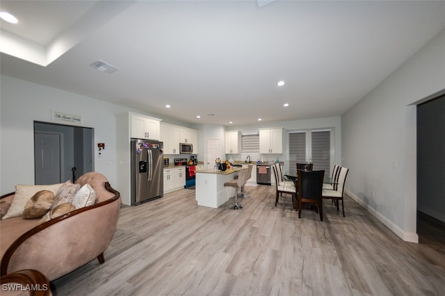 living room with light hardwood / wood-style floors