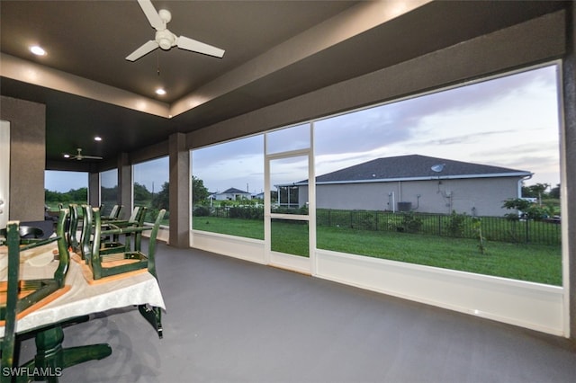 sunroom featuring ceiling fan