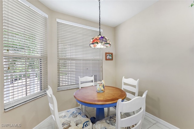 dining area with light tile patterned flooring