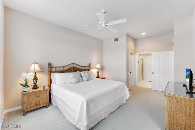 carpeted bedroom featuring ceiling fan and a closet