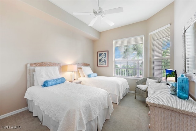 bedroom with ceiling fan and light colored carpet