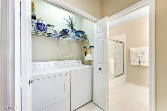 washroom featuring washing machine and clothes dryer