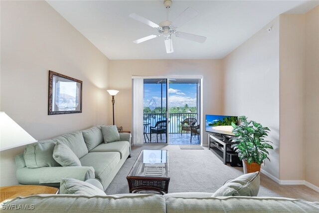 living room with ceiling fan and light carpet