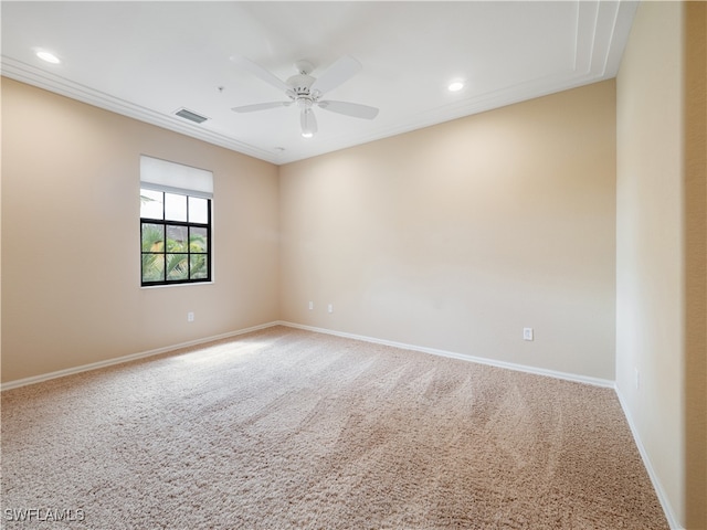 spare room with ceiling fan and carpet floors