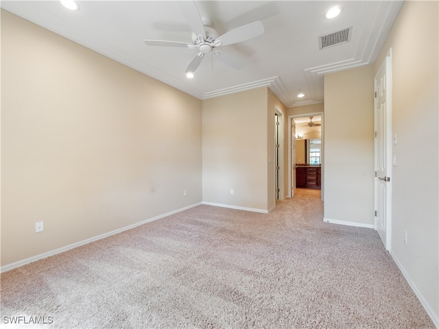 carpeted spare room featuring crown molding and ceiling fan