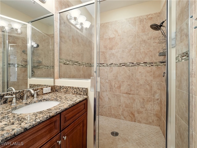 bathroom featuring vanity and walk in shower