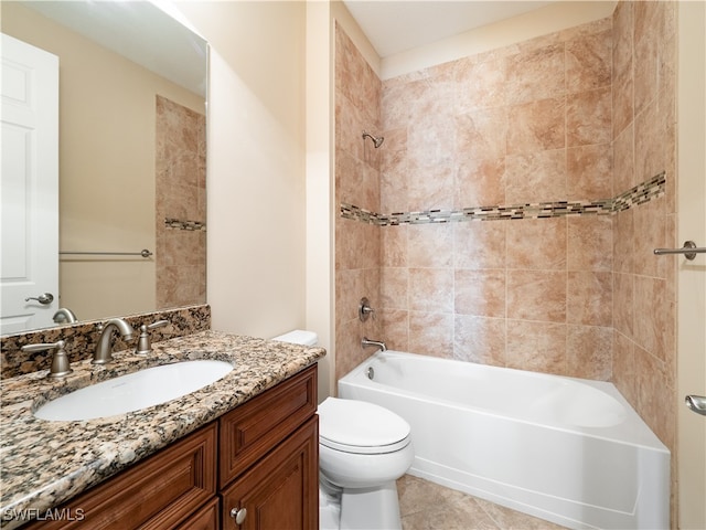 full bathroom with tile patterned flooring, toilet, tiled shower / bath combo, and vanity