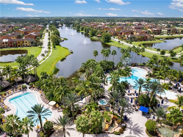 birds eye view of property with a water view