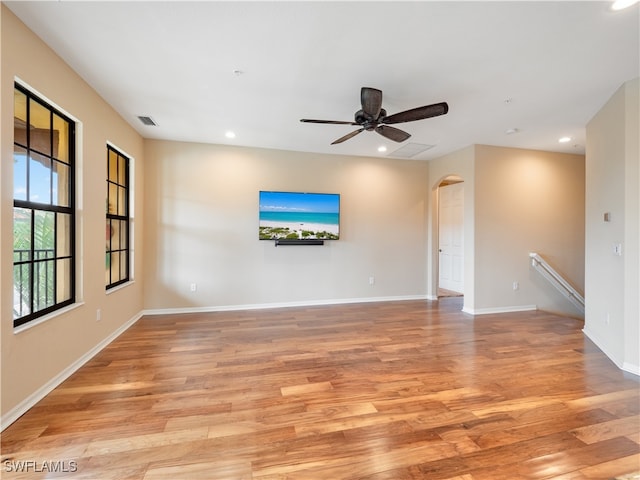 unfurnished living room with ceiling fan and light hardwood / wood-style floors