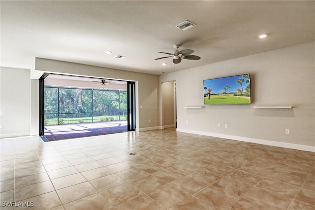 tiled empty room with ceiling fan