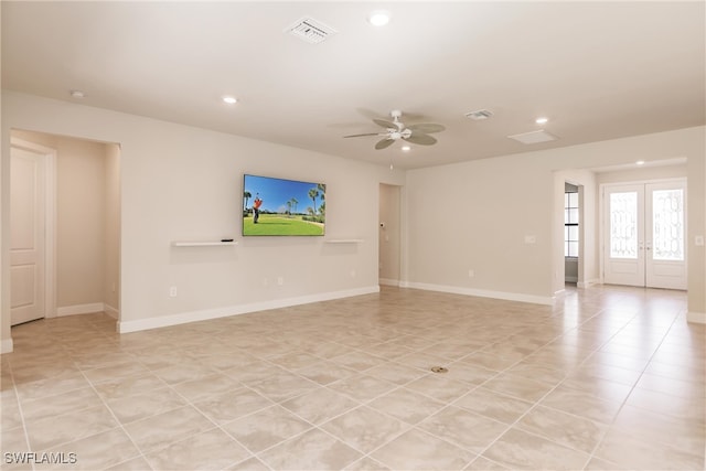 unfurnished living room featuring french doors, light tile patterned flooring, and ceiling fan