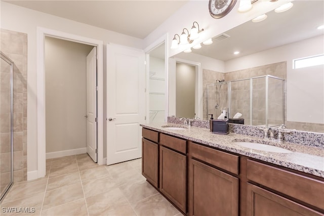 bathroom with vanity, tile patterned floors, and an enclosed shower