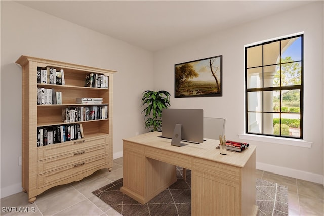 tiled office space featuring a healthy amount of sunlight